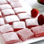 trawberry jelly-filled brownies with rich chocolate layers and strawberry jelly filling, garnished with fresh strawberries