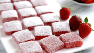 trawberry jelly-filled brownies with rich chocolate layers and strawberry jelly filling, garnished with fresh strawberries