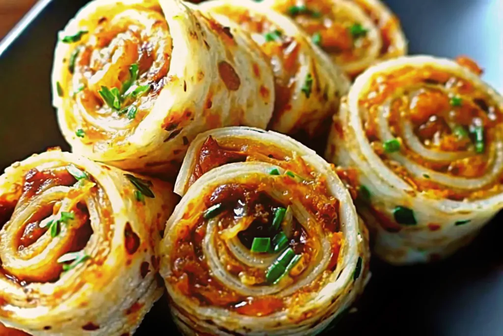 Irresistible Pepper Jelly Air Fryer Pinwheels on a serving board