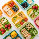 Colorful school lunch ideas for kids in organized lunch boxes
