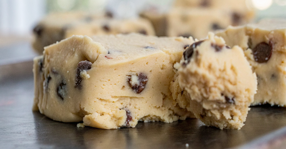 Final presentation of No-Bake Cookie Dough Fudge cut into perfect squares on a white serving plate